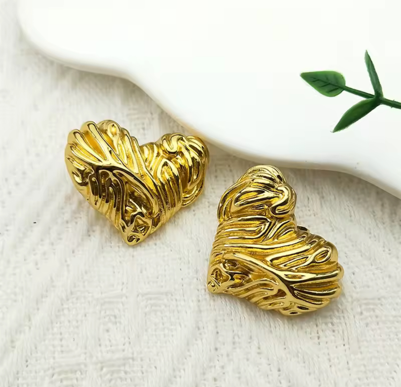 Woman wearing gold earrings