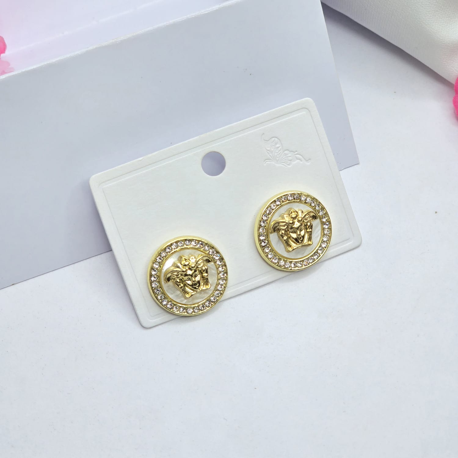 White/golden earrings