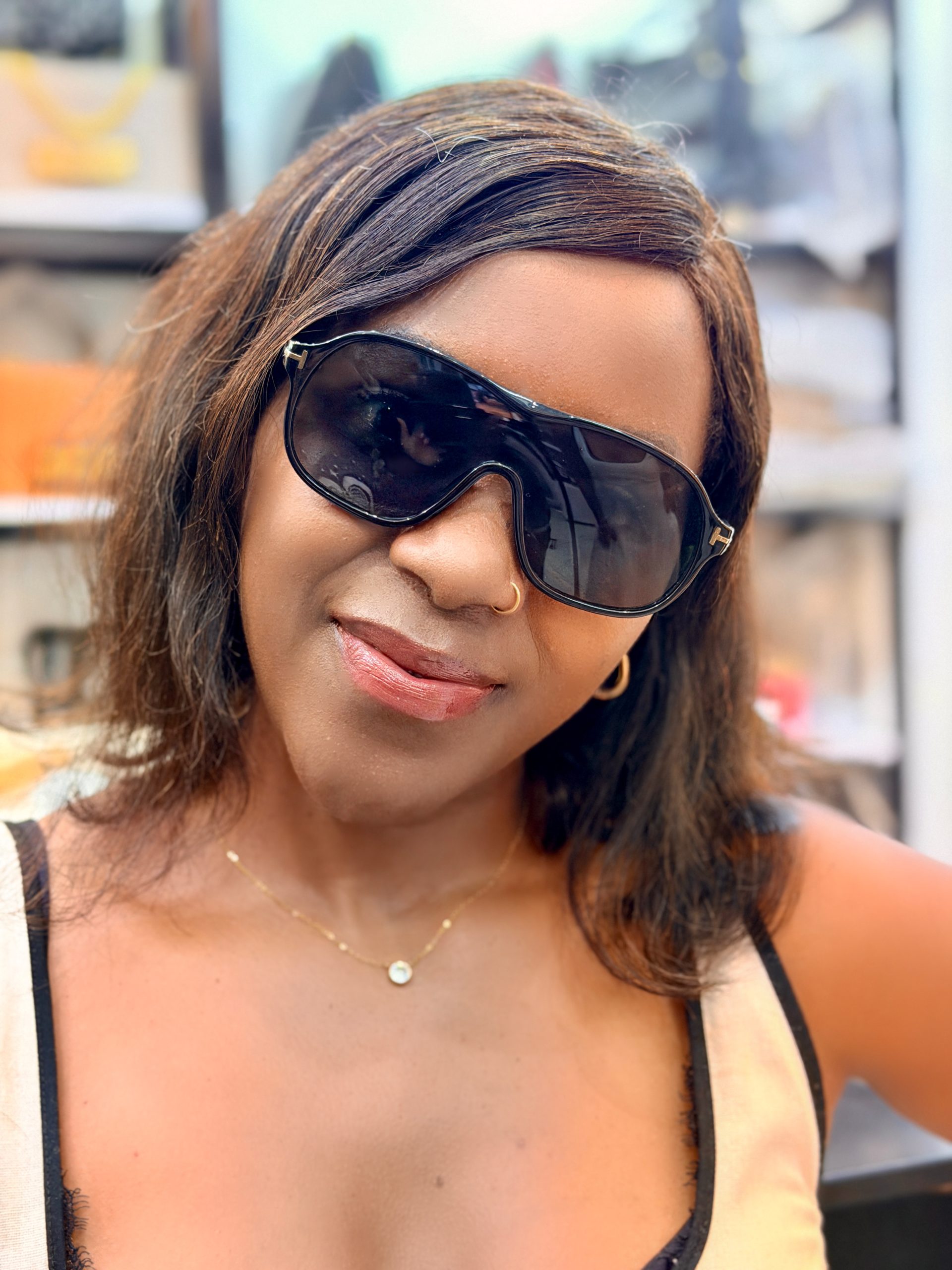 Lady wearing black sunglasses. Perfect for a sunny day.