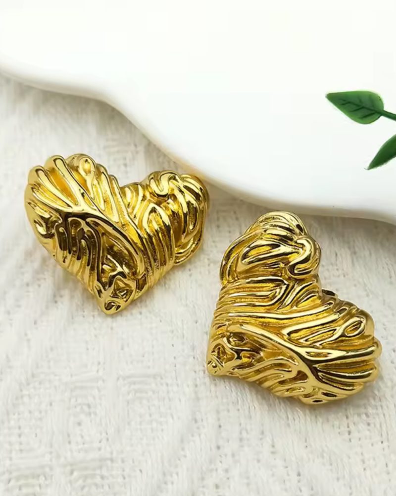 Woman wearing gold earrings