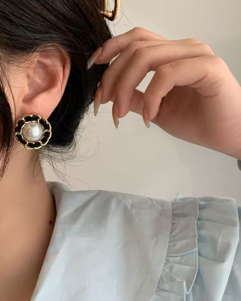 Woman wearing stud earrings