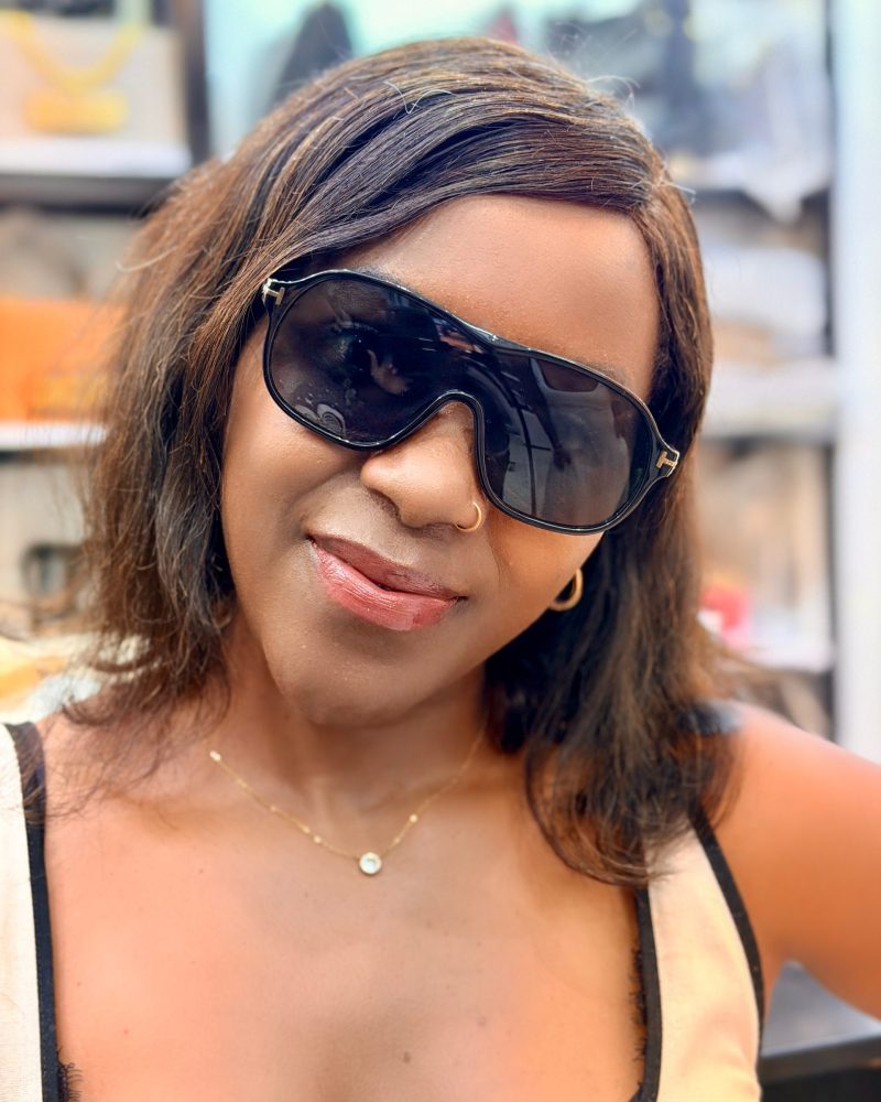 Lady wearing black sunglasses. Perfect for a sunny day.
